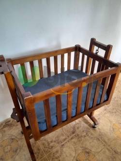 Baby cot with a mattress 